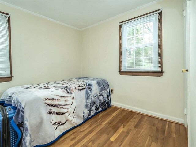 2195 3rd St, East Meadow, NY 11554 - bedroom featuring wood finished floors and ornamental molding