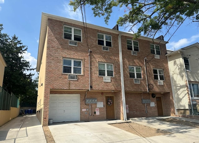 66-60 69th St, Middle Village, NY 11379 - multi unit property featuring driveway, brick siding, and a garage