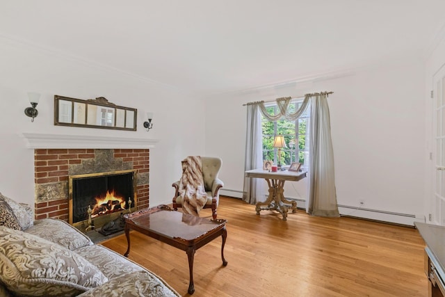 5 Ridgeview Dr, Pleasantville, NY 10570 - living area featuring a baseboard radiator, light wood-style flooring, a brick fireplace, and crown molding