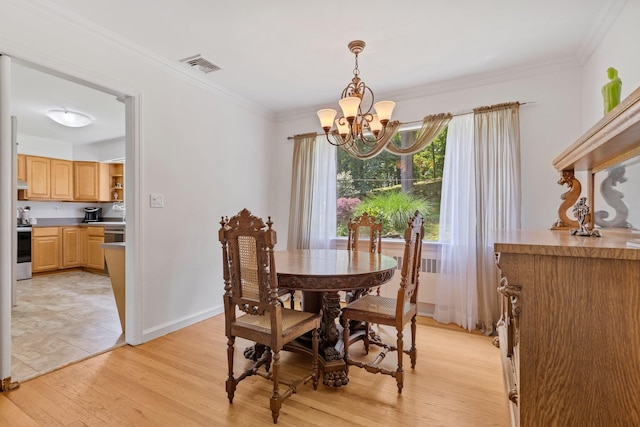5 Ridgeview Dr, Pleasantville, NY 10570 - dining area with a chandelier, light wood-style floors, and crown molding