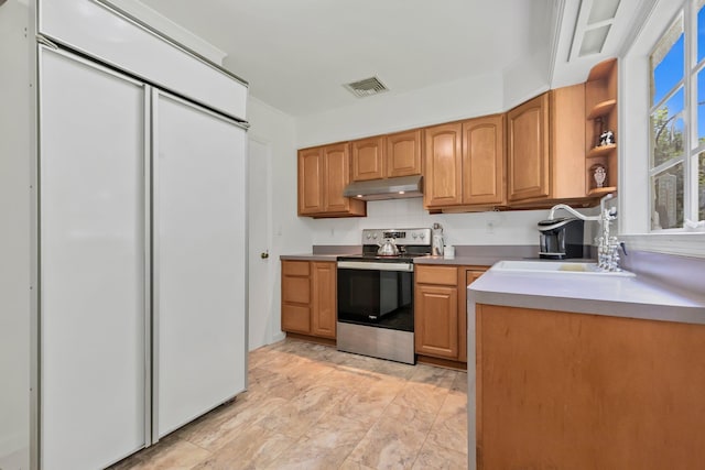5 Ridgeview Dr, Pleasantville, NY 10570 - kitchen featuring stainless steel range with electric cooktop, paneled fridge, under cabinet range hood, light countertops, and open shelves