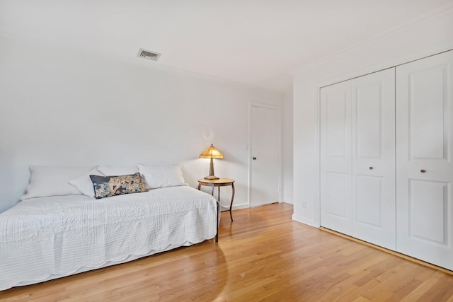 5 Ridgeview Dr, Pleasantville, NY 10570 - bedroom featuring wood finished floors, ornamental molding, and a closet