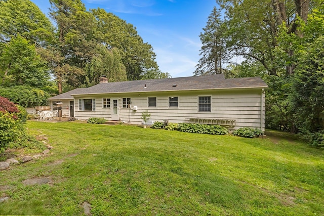 5 Ridgeview Dr, Pleasantville, NY 10570 - back of house featuring a yard, a chimney, a patio, and entry steps