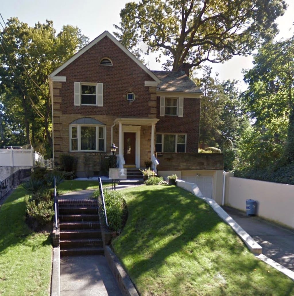 8687 Palermo St, Holliswood, NY 11423 - view of front of property with brick siding and a garage