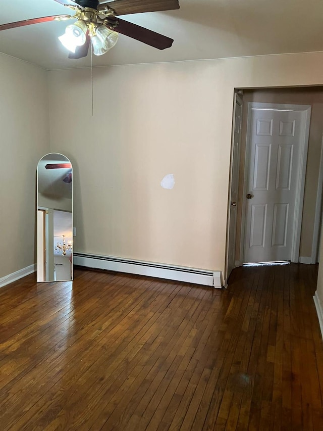 724A E 223rd St, Bronx, NY 10466 - spare room with a ceiling fan, baseboard heating, dark wood-style floors, and baseboards