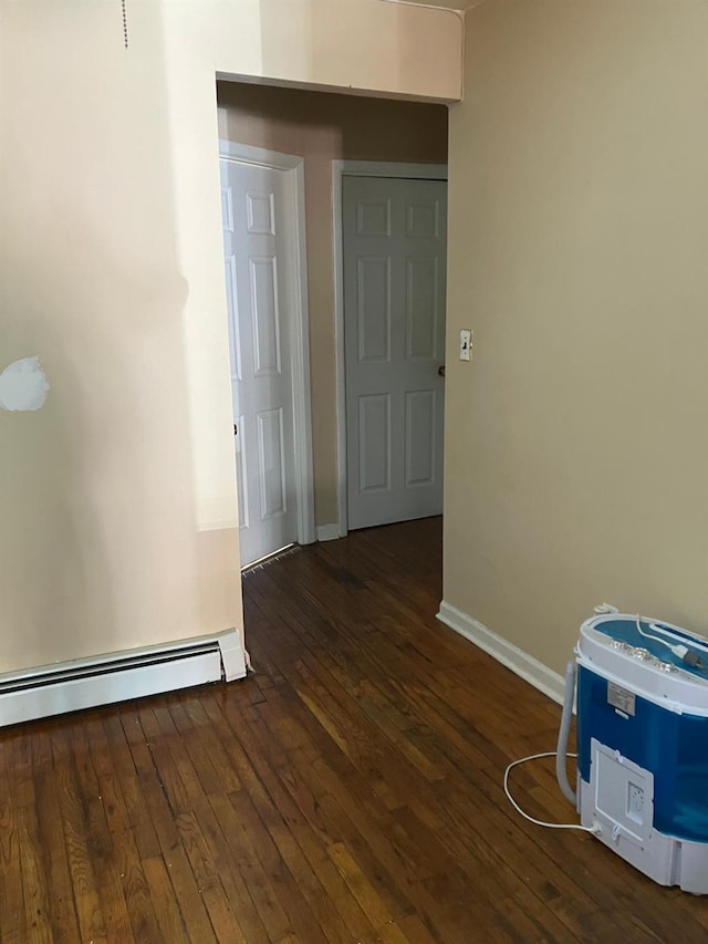 724A E 223rd St, Bronx, NY 10466 - spare room featuring wood-type flooring, baseboards, and a baseboard heating unit