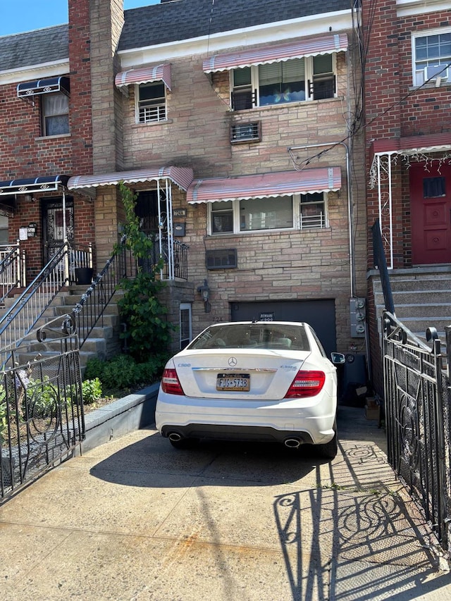 724A E 223rd St, Bronx, NY 10466 - multi unit property featuring a garage, a shingled roof, concrete driveway, and a chimney