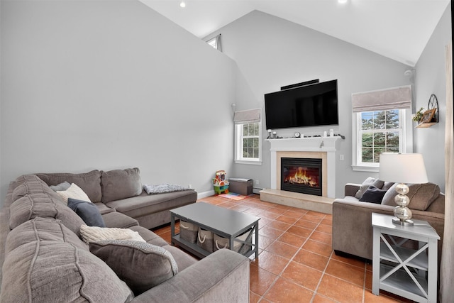 2 SE Ct, Wallkill, NY 12589 - living room with high vaulted ceiling, a glass covered fireplace, tile patterned flooring, recessed lighting, and a baseboard heating unit