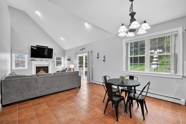 2 SE Ct, Wallkill, NY 12589 - tiled dining area featuring a baseboard radiator, a chandelier, a glass covered fireplace, high vaulted ceiling, and recessed lighting