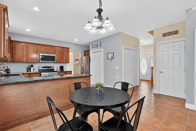2 SE Ct, Wallkill, NY 12589 - dining room with a chandelier, light tile patterned floors, arched walkways, and recessed lighting
