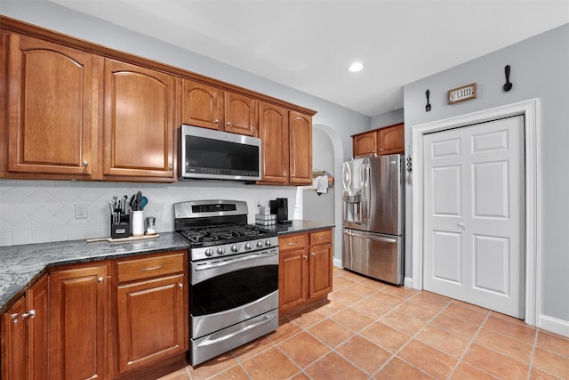 2 SE Ct, Wallkill, NY 12589 - kitchen with stainless steel appliances, backsplash, brown cabinetry, and recessed lighting