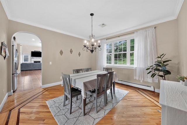 2 SE Ct, Wallkill, NY 12589 - dining space featuring a baseboard radiator, arched walkways, crown molding, a chandelier, and light wood-style flooring