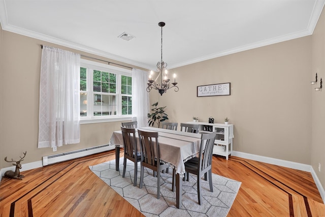 2 SE Ct, Wallkill, NY 12589 - dining area with baseboard heating, crown molding, a chandelier, and wood finished floors