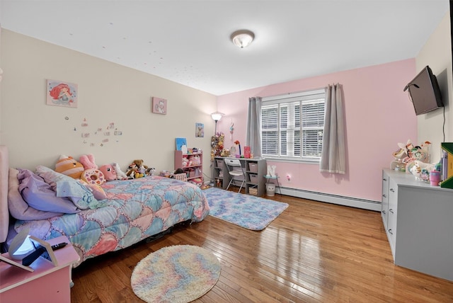 2 SE Ct, Wallkill, NY 12589 - bedroom with a baseboard heating unit and light wood-style floors