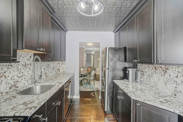 460 Old Town Rd Unit 10A, Port Jefferson Station, NY 11776 - kitchen with tasteful backsplash, light stone counters, an ornate ceiling, and appliances with stainless steel finishes