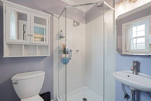 460 Old Town Rd Unit 10A, Port Jefferson Station, NY 11776 - bathroom featuring a stall shower and crown molding