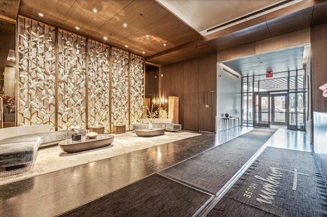 133-36 37th Ave Unit 11H, Flushing, NY 11354 - lobby featuring a high ceiling and wooden walls