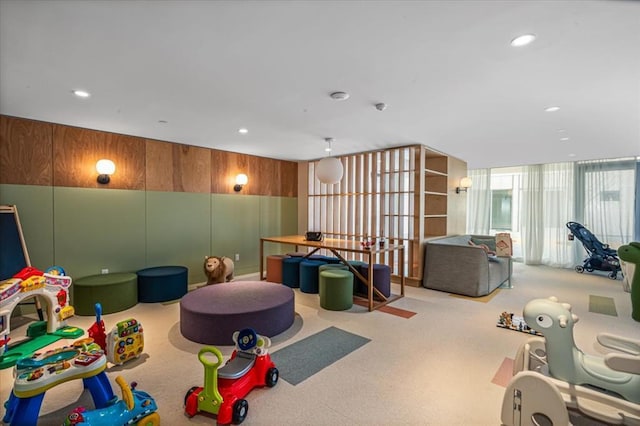 133-36 37th Ave Unit 11H, Flushing, NY 11354 - recreation room with carpet floors, recessed lighting, and wood walls