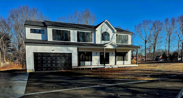 117 Currans, Middle Island, NY 11953 - view of front of house featuring a porch and a garage