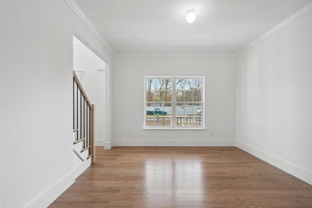 117 Currans, Middle Island, NY 11953 - unfurnished room with crown molding, wood finished floors, stairway, and baseboards
