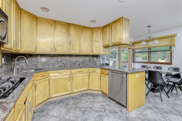 78 College Rd, Monsey, NY 10952 - kitchen with black appliances, tasteful backsplash, dark stone countertops, light brown cabinets, and a peninsula