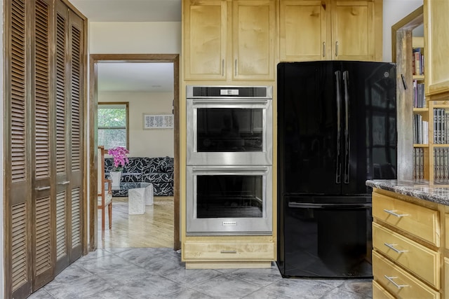 78 College Rd, Monsey, NY 10952 - kitchen featuring freestanding refrigerator, double oven, light brown cabinetry, and stone countertops
