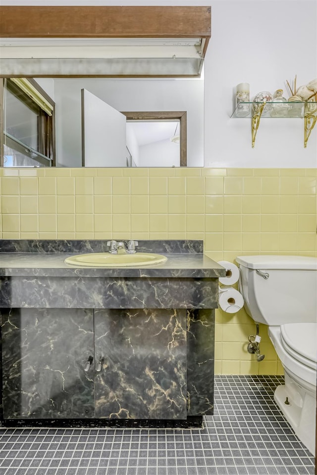78 College Rd, Monsey, NY 10952 - half bath featuring vanity, tile patterned flooring, and tile walls