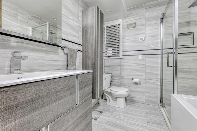 78 College Rd, Monsey, NY 10952 - bathroom featuring tile walls, a shower stall, vanity, tile patterned floors, and a bathtub