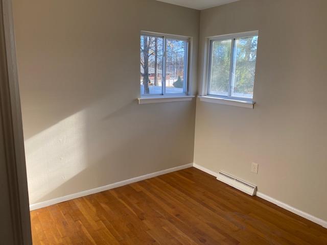 5 Appletree Dr, Saugerties, NY 12477 - spare room with baseboard heating, baseboards, and wood finished floors