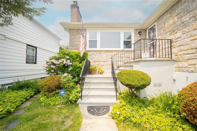 62 Murray Ave, Yonkers, NY 10704 - doorway to property with stone siding and a chimney
