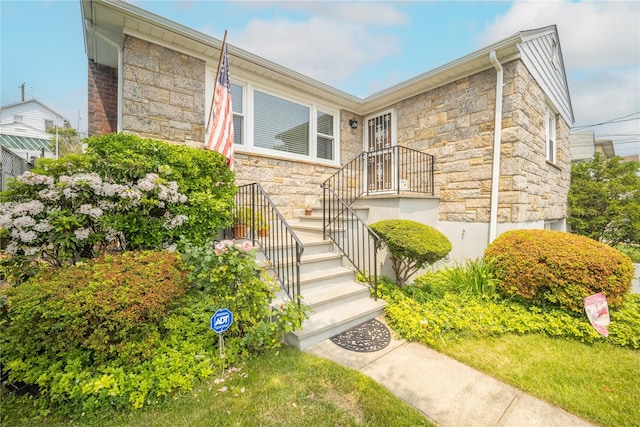 62 Murray Ave, Yonkers, NY 10704 - view of front of house with stone siding and stairway