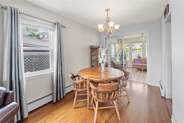 62 Murray Ave, Yonkers, NY 10704 - dining room featuring a baseboard radiator, a chandelier, and light wood-type flooring