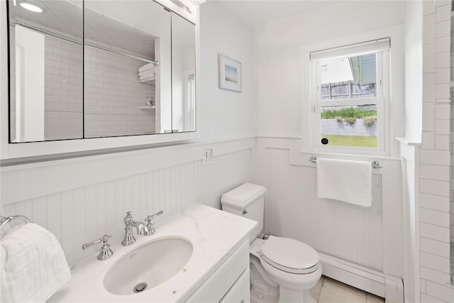 62 Murray Ave, Yonkers, NY 10704 - full bathroom with a wainscoted wall, a baseboard radiator, tiled shower, and vanity