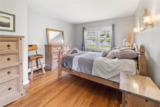 62 Murray Ave, Yonkers, NY 10704 - bedroom featuring a baseboard radiator and light wood-style floors