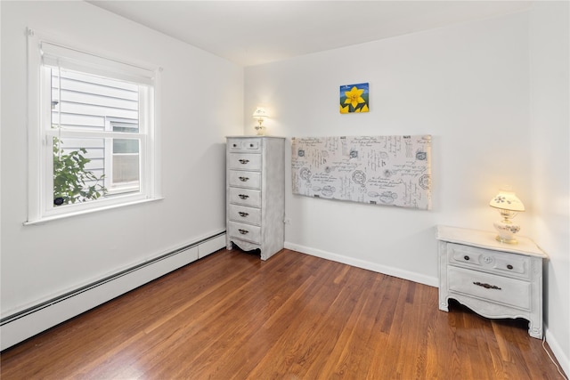 62 Murray Ave, Yonkers, NY 10704 - bedroom featuring a baseboard radiator and wood finished floors