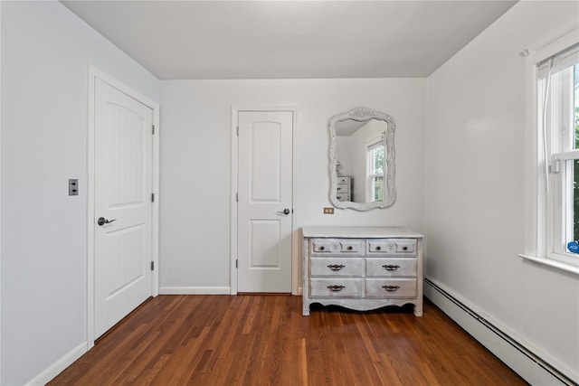 62 Murray Ave, Yonkers, NY 10704 - bedroom featuring baseboard heating and dark wood-style flooring
