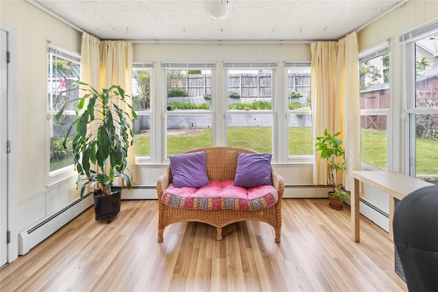62 Murray Ave, Yonkers, NY 10704 - sunroom with a baseboard heating unit and wood finished floors