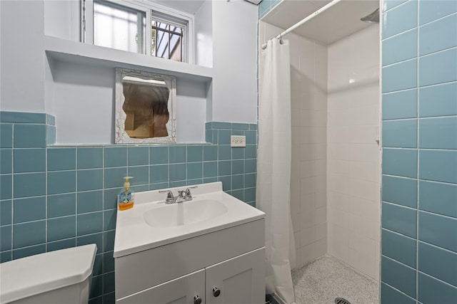 62 Murray Ave, Yonkers, NY 10704 - full bath with tile walls, vanity, a tile shower, and wainscoting