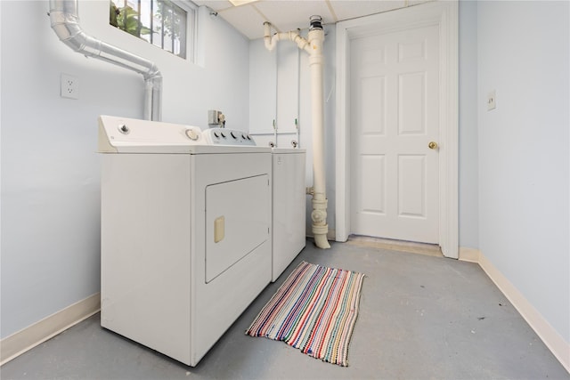 62 Murray Ave, Yonkers, NY 10704 - laundry area with washer and dryer and baseboards