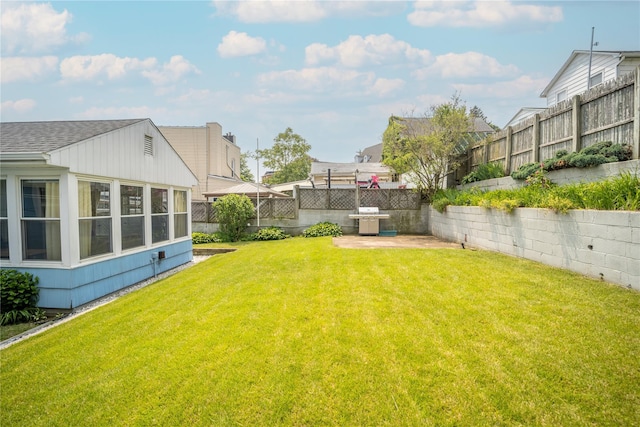 62 Murray Ave, Yonkers, NY 10704 - fenced backyard featuring a patio and a sunroom
