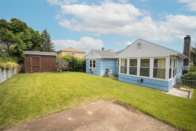 62 Murray Ave, Yonkers, NY 10704 - rear view of house with a storage shed, a fenced backyard, and a chimney