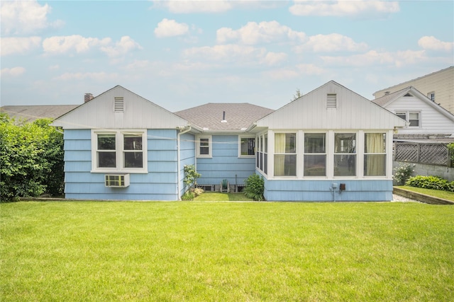 62 Murray Ave, Yonkers, NY 10704 - back of house featuring a lawn, a sunroom, a shingled roof, and a wall mounted AC