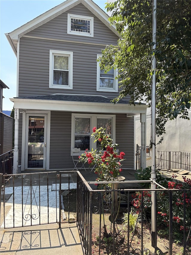 3446 Kingsbridge Ave, Bronx, NY 10463 - traditional style home with covered porch and a fenced front yard