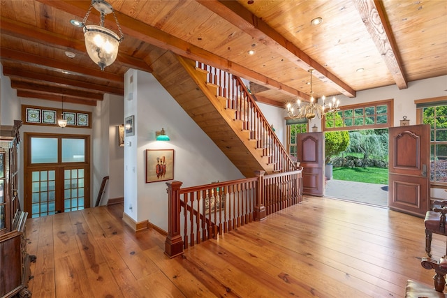 215 Hillcrest Dr N, Orient, NY 11957 - entrance foyer featuring a wooden ceiling with exposed beams, hardwood / wood-style flooring, and a chandelier