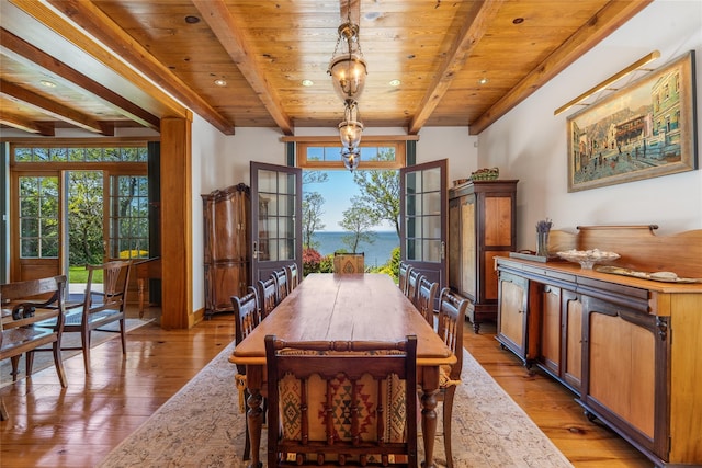 215 Hillcrest Dr N, Orient, NY 11957 - dining space with a wooden ceiling with exposed beams, healthy amount of natural light, light wood-type flooring, and a water view