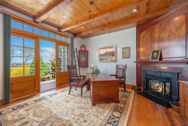 215 Hillcrest Dr N, Orient, NY 11957 - office space with a wood ceiling with exposed beams, wood finished floors, and a fireplace with flush hearth