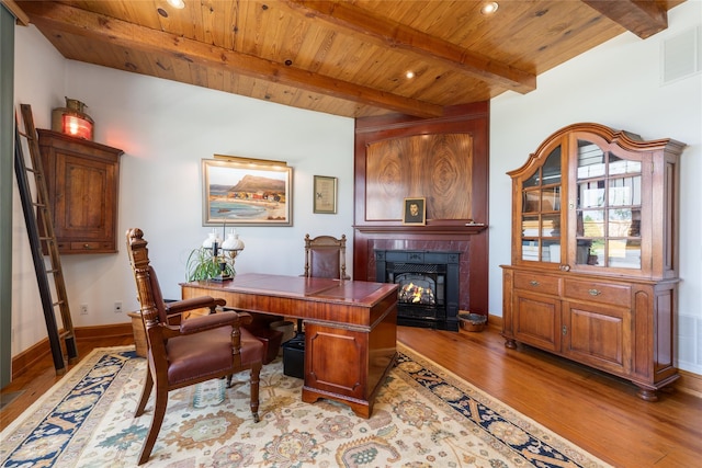 215 Hillcrest Dr N, Orient, NY 11957 - office area featuring a wood ceiling with exposed beams, wood finished floors, a glass covered fireplace, and recessed lighting