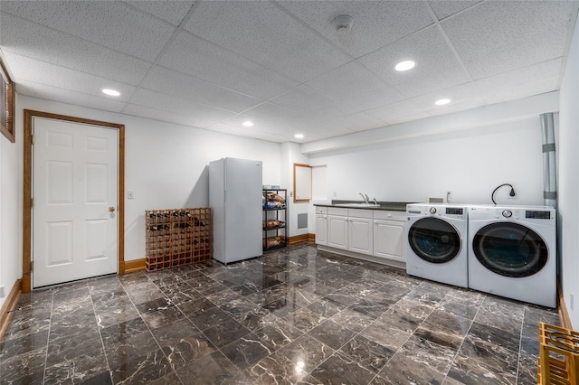 215 Hillcrest Dr N, Orient, NY 11957 - laundry room featuring washing machine and dryer, cabinet space, and recessed lighting