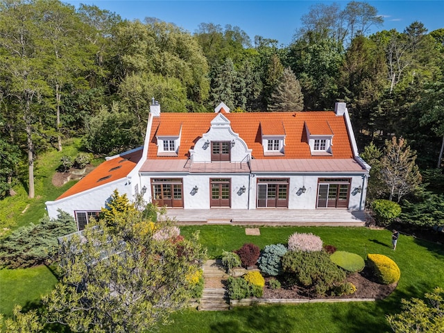 215 Hillcrest Dr N, Orient, NY 11957 - rear view of property with a chimney, french doors, a yard, and a view of trees