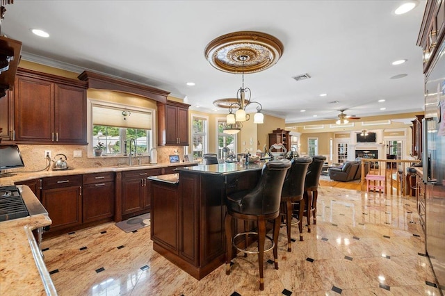 135 Millet St N, Dix Hills, NY 11746 - kitchen featuring crown molding, a ceiling fan, a sink, decorative backsplash, and recessed lighting